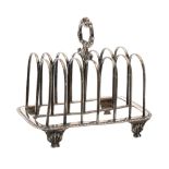 William IV silver six-division toast rack, surmounted by a scrolling ring handle, raised on shell