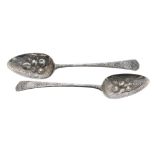 Pair of embossed silver fruit spoons, the handles with crested cartouche on a finely engraved