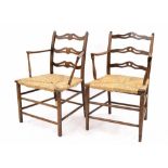 Matched pair of 19th century rush seat ladder back open armchairs, with horizontal pierced splats