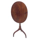 19th century oval mahogany tilt-top occasional table, upon a turned column with downswept