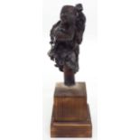 Japanese bronze bust sculpture of a trader, carrying timber on his back and with belt of leaves,