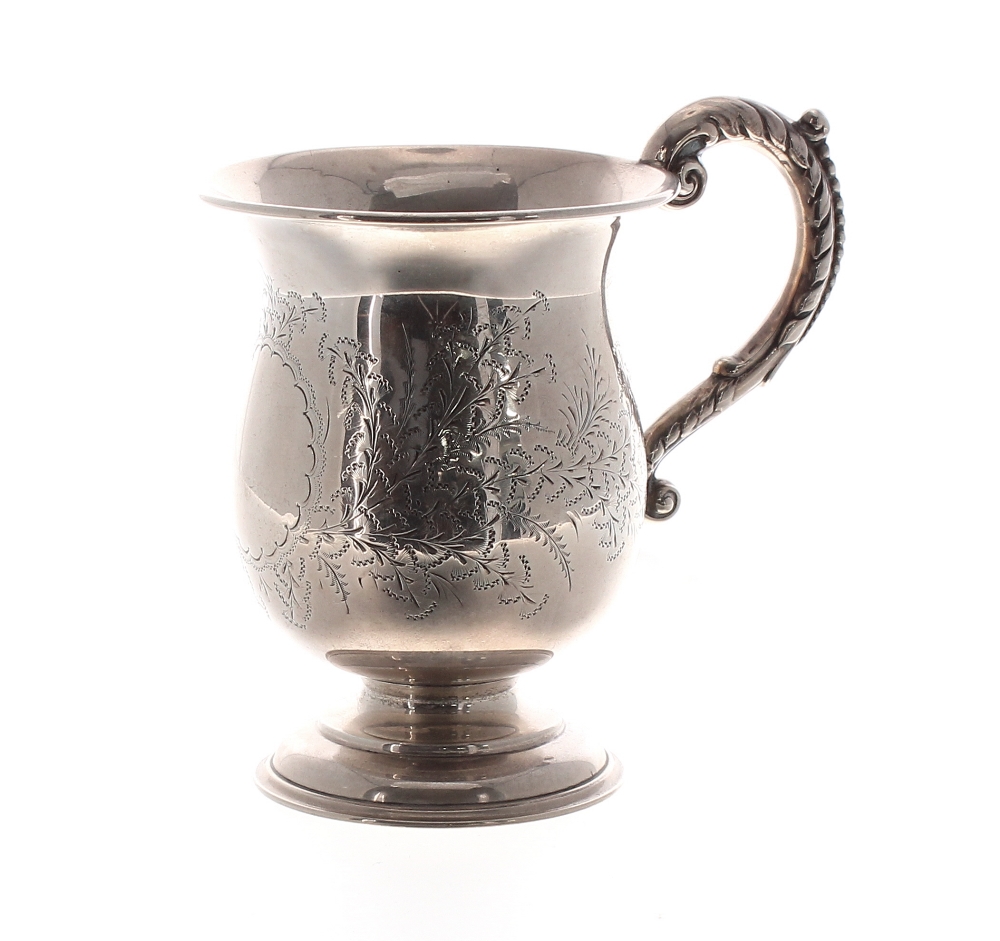 Edwardian silver cup, foliate engraved around a vacant cartouche with capped C-scroll handle,