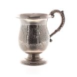 Edwardian silver cup, foliate engraved around a vacant cartouche with capped C-scroll handle,