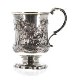 Good Victorian silver pedestal christening cup, with a leaf capped scrolling handle and embossed