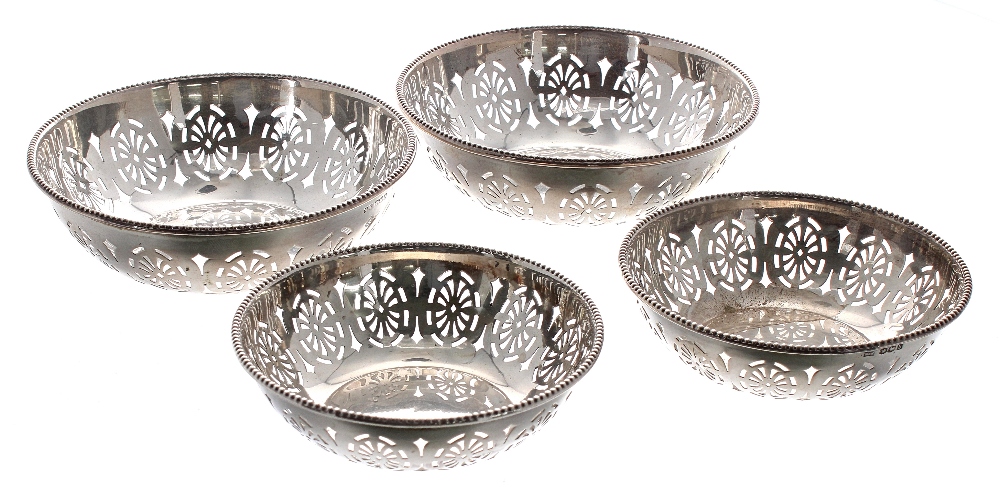 Set of four George V circular pierced silver bowls, maker Walker & Hall, Sheffield 1919, two at 5"