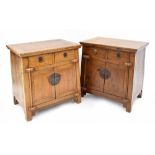 Pair of 19th Chinese Ningbo elm cabinets, of tapered form, each inset with two drawers over