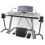 Yamaha 9000 Pro keyboard, with stand and cover, complete with lights, a Yamaha YST-MS50 speaker