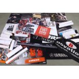 Large Yamaha floor rug, 39" x 65"; together with a large quantity of shop dealership promotional