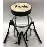 Fender Acoustics guitar stool; together with two A-frame guitar stands (3)