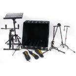 Selection of stands, including a folding suitcase rack to hold six guitars, four Fender guitar