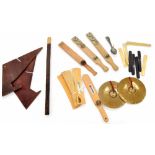 Collection of percussion whips and slapsticks etc; together with bone instruments, spoons and