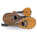 Two Neapolitan style bowl back mandolins and a miniature flatback mandolin, all in need of