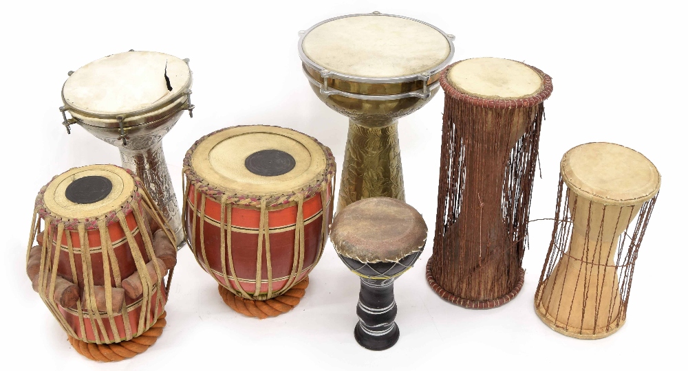 Collection of ethnic drums; including Darabukka, Tabla and talking drums (7)