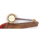 Interesting Oriental three string zither banjo, within a tooled leather case