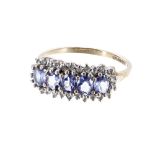 9ct tanzanite and diamond dress ring, width 8mm, 2.7gm, ring size N