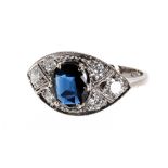 18ct white gold sapphire and diamond ring in the Art Deco manner, the central oval sapphire 1.10ct