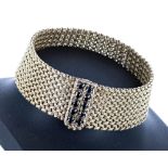 9ct yellow gold textured woven link bracelet, the clasp set with ten round sapphires, London 1966,