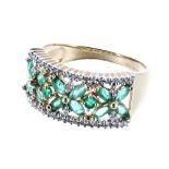 9ct emerald and diamond floral band ring, 4.1gm, width 10mm, ring size Q