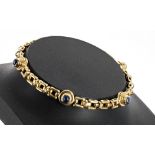 Attractive 18ct yellow gold sapphire cabouchon set bracelet, set with four cabouchon between fancy