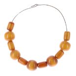 Amber bead wirework necklet, consisting of eleven beads, 95.1gm