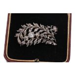 White metal rose diamond set floral design pierced spray brooch, 0.70ct approx, 10.2gm, 46mm - **