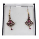 Pair of Art Nouveau style flared drop earrings set with diamonds and rubies, wire hook backs, drop