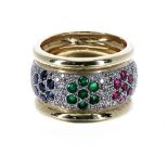 18ct yellow diamond, sapphire, ruby and emerald band ring, with three floral clusters on a diamond