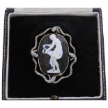 Fine quality carved oval hardstone cameo brooch depicting a classical lady bathing, set in a