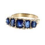 18ct yellow gold claw set sapphire and diamond ring, with five graduated sapphires set between