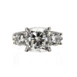 Fine GIA certified platinum three stone diamond ring, cushion brilliant-cut centre stone, 3.01ct,