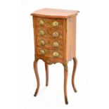 Attractive Continental small walnut bedside commode chest, the serpentine crossbanded top over