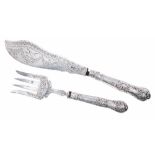 Pair of Victorian silver fish servers, with scrolling engraved decoration and silver King's