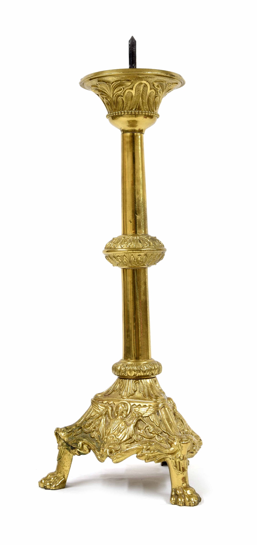 Antique brass ecclesiastical candlestick, raised on a trefoil base with repousse panels of a