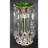 Bohemian late 19th century green glass overlaid table lustre, painted with floral panels and