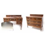 Walnut two piece bedroom suite comprising a chest of drawers and dressing tablle, both with raised