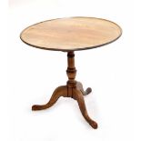George III mahogany circular tripod table, the moulded dish tilt-top upon a barrel turned column