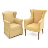 Edwardian upholstered wing armchair, with cream upholstery upon square tapering front supports,