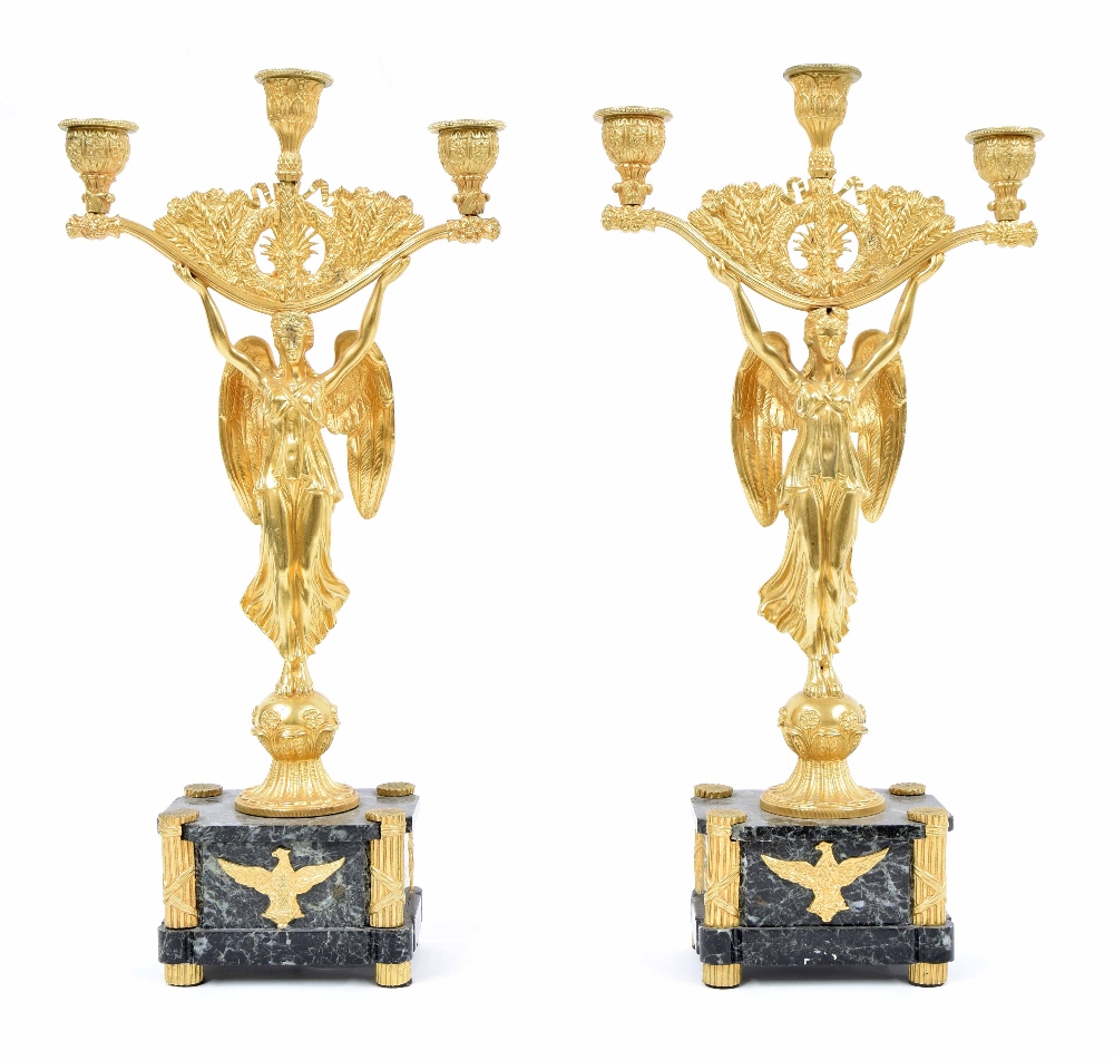 Good pair of Regency Empire ormolu and marble figural candelabra, modelled as angels holding three