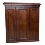 Victorian mahogany triple panelled robe, the stepped moulded cornice over three panelled doors,