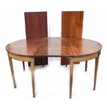 Georgian mahogany D-end extending dining table, with three spare leaves, in need of further brass