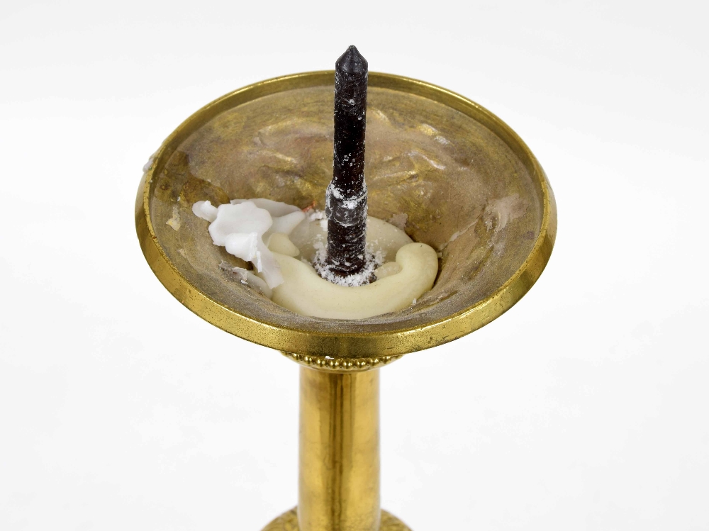 Antique brass ecclesiastical candlestick, raised on a trefoil base with repousse panels of a - Image 3 of 4