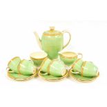 Grindley demi tasse coffee set for six, on a pastel green ground with foliate painted borders