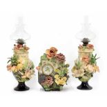 Late 19th century French Barbotine Majolica mantel clock garniture, modelled with flowers, the