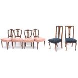 Set of four shield back dining chairs, stuffover upholstered on reeded legs, 21'' wide, 36" high;