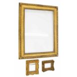 Carved giltwood picture frame, 30" x 40" total, aperture measures 22" x 31.5"; together with two