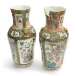 Pair of Chinese Canton famille rose porcelain vases, of shouldered form, with figural garden scene