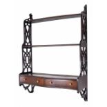 Chippendale style mahogany graduated three tier wall shelf, with fretwork side panels over the