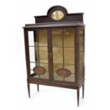 Edwardian mahogany glazed display cabinet, with raised back inset with mirror, over two panelled