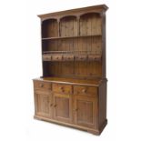 Stained pine dresser, the galleried shelf raised back over base section of three short drawers
