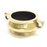 Chinese polished bronze censer, with twin ring handles raised on a low foot rim, six character